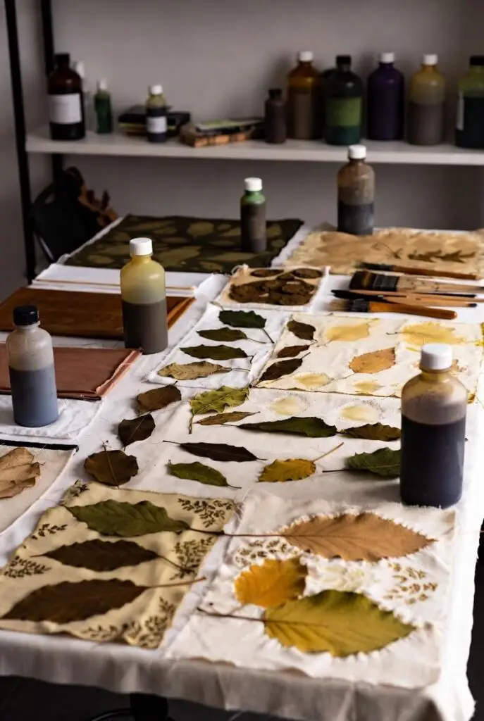 Artisan workspace with natural plant dyes and botanical eco-printing materials